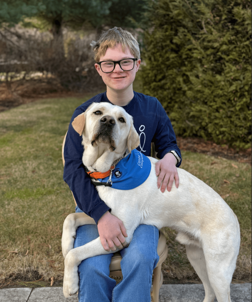 boy and a dog in his lap