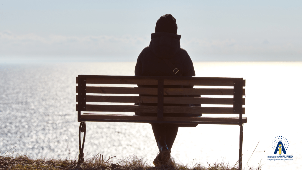 person sitting alone on a bench